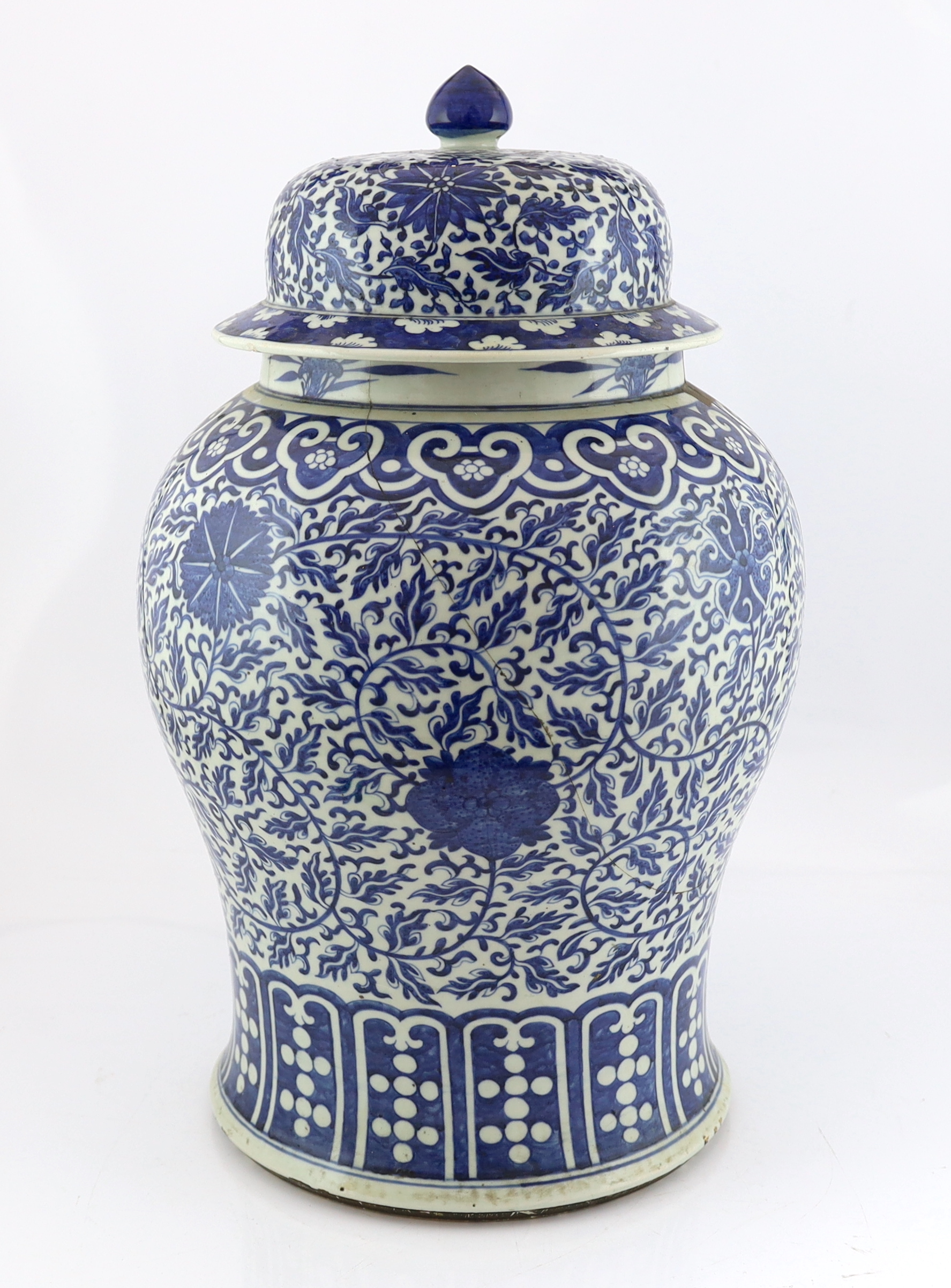 A massive Chinese blue and white ‘lotus’ vase and cover, 18th/19th century, broken and glued